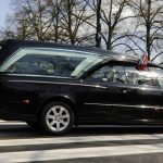 Funeral home in Poland apologises after corpse falls out of hearse in