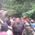 At least 21 killed after bus skids and plummets down mountain by popular scenic waterfall in Sri Lanka