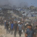 Israeli tanks ‘open fire into crowd trying to get food from aid trucks in Gaza killing dozens’ as IDF launches probe