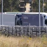 13 freezing UK-bound migrants found trapped in fridge lorry after driver heard them ‘screaming for help’ near Calais