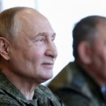 Putin dons military fatigues in war games 500 miles from the frontline in a show of strength to the West