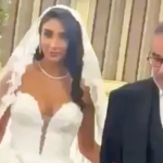 Fury as daughter of Ayatollah’s henchman who ordered Iran’s brutal hijab crackdown wears plunging Western wedding dress