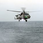 Royal Marine sniper takes out smuggling gang speedboat engine with single shot while flying BACKWARDS in chopper