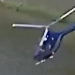 Horror moment helicopter plunges out of the sky and crashes into lake in front of horrified anglers