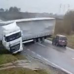 Horrifying moment skidding jackknifed lorry flattens car killing two after losing control on rain-soaked road