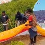 Shocking moment migrant tries to PARAGLIDE into Europe over fortified fence