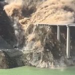Staggering moment 2,500ft bridge collapses in cloud of dust just MONTHS after opening in China