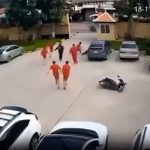 Shocking moment gangster’s moll hands jailed kingpin a gun outside court before he launches brazen daylight escape