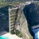 Fury at giant 600ft ‘eyesore’ elevator being built on world’s most beautiful beach…as tourists are too lazy to hike down
