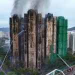 Death toll climbs to 55 in devastating Hong Kong tower block fire with hundreds more feared dead as three arrested