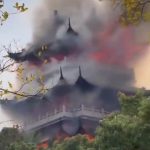 Tragic moment huge blaze engulfs temple after ‘irresponsible’ tourist is blamed for wrongly using a candle