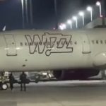 Shocking moment two passengers RUN across tarmac in bid to catch their missed Wizz Air flight from city break hotspot