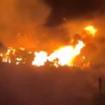 Horror footage shows massive fire sweep through town burning 170 homes and killing at least one in Japan