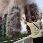 At least 4 dead as horror fire engulfs THREE 31-floor high rise apartment buildings with residents trapped in Hong Kong
