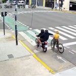 Incredible moment female tourist, 33, fights off idiot motorbike muggers who tried to snatch her phone in street