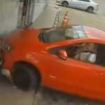 Horror moment driver presses the wrong pedal while parking and smashes into bystander crushing him against the wall