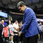 Awkward moment Venezuela tyrant Maduro salsas with robot as US flies special operations troops into Caribbean