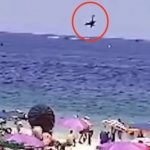 Horror moment banner plane nosedives into sea in front of horrified beachgoers on packed shoreline killing pilot