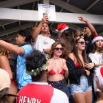 Thousands of revellers flood one of Australia’s most popular beaches as backpackers in bikinis celebrate Christmas Day