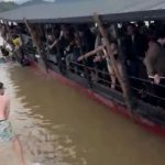 Terrifying moment tourist ferry fills with water in Laos sending Brits scrambling to safety