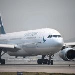 Passenger, 20, arrested after trying to open plane’s door mid-air on Cathay Pacific flight