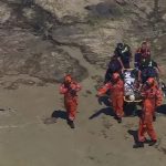 Tourist, 25, plunges 20ft from steep ledge on cliff sparking nail-biting rescue mission