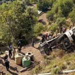 At least five passengers dead after bus carrying tourists plunges into 230ft gorge as desperate rescue effort launched