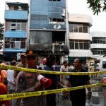 Pregnant woman among at least 22 killed as inferno rips through office building in Indonesia leaving people trapped