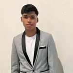 Teen footballer drowns after plunging into lake while paddleboarding as brother, 11, is rescued from water