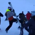 Moment snowboarders & skier brawl in the snow on mountain slope after argument breaks out following crash