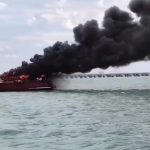 Dramatic moment luxury yacht explodes in fireball forcing captain and crew to leap into sea as vessel burns to a crisp