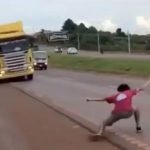 Terrifying moment idiot teen plays twisted game of ‘chicken’ with huge 12-wheeler lorry nearly causing horror crash