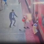 Horrifying moment father and young son are dragged by moving train as desperate onlookers try to rescue them