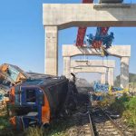 At least 22 dead and 80 injured after a crane collapses and smashes through a moving train in Thailand sparking a fire