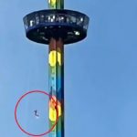 Stomach-churning moment terrified tourists dangle 200ft in air from spinning ride after it breaks down mid-air