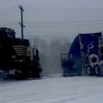 Heart-stopping moment train smashes into a truck stuck on the rail line after a ‘bomb cyclone’ snowstorm